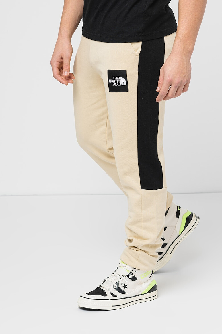 The North Face Pantaloni cu benzi laterale contrastante Fine Alpine - Pled.ro