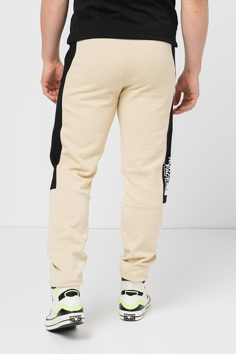 The North Face Pantaloni cu benzi laterale contrastante Fine Alpine - Pled.ro