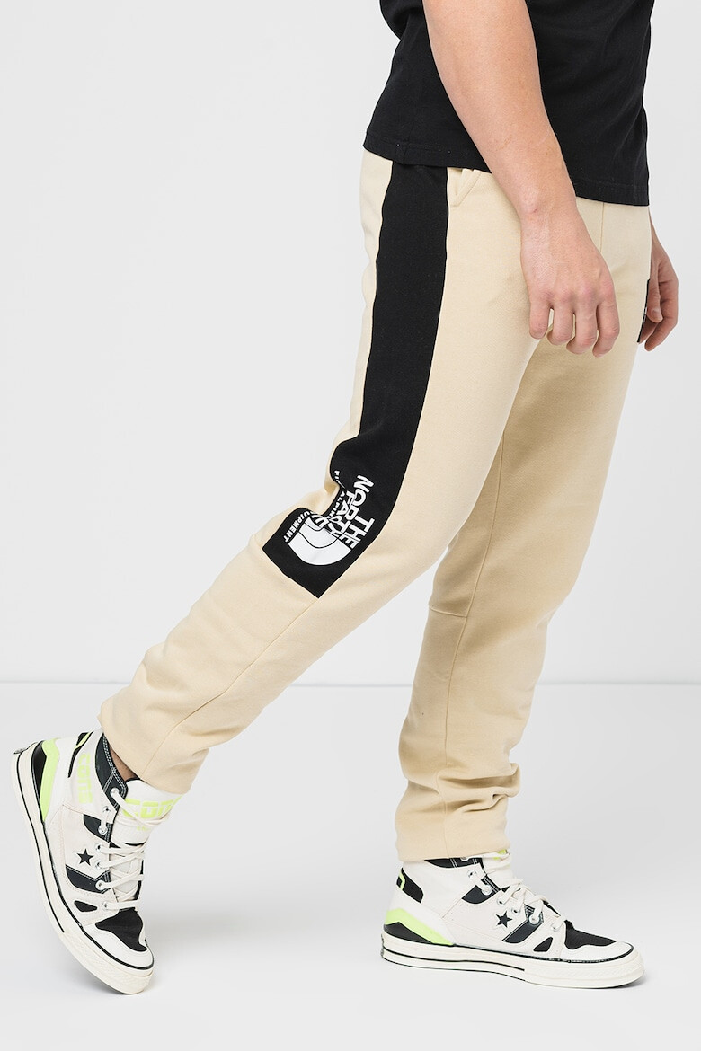 The North Face Pantaloni cu benzi laterale contrastante Fine Alpine - Pled.ro