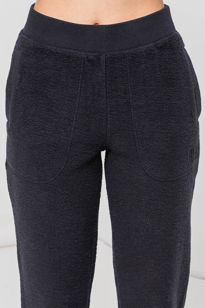 UGG Pantaloni de trening din material fleece cu buzunare laterale Sofiana - Pled.ro