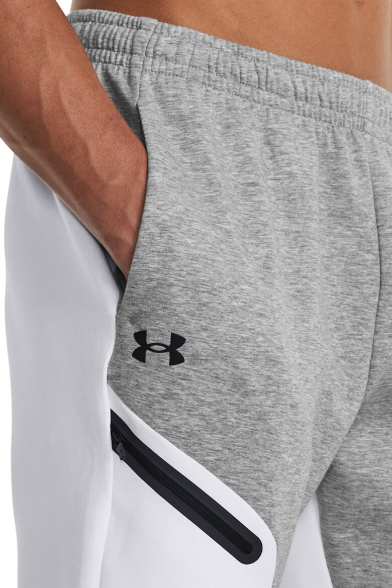 Under Armour Pantaloni conici cu uscare rapida pentru fitness Unstoppable - Pled.ro