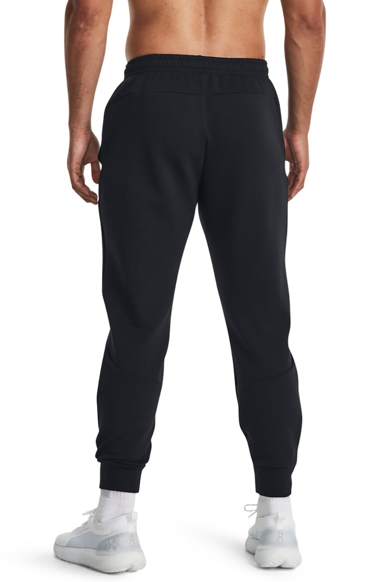 Under Armour Pantaloni conici cu uscare rapida pentru fitness Unstoppable - Pled.ro