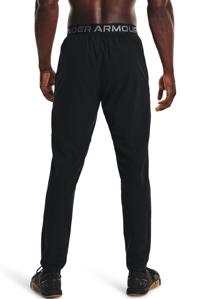 Under Armour Pantaloni tesuti cu logo pentru fitness - Pled.ro