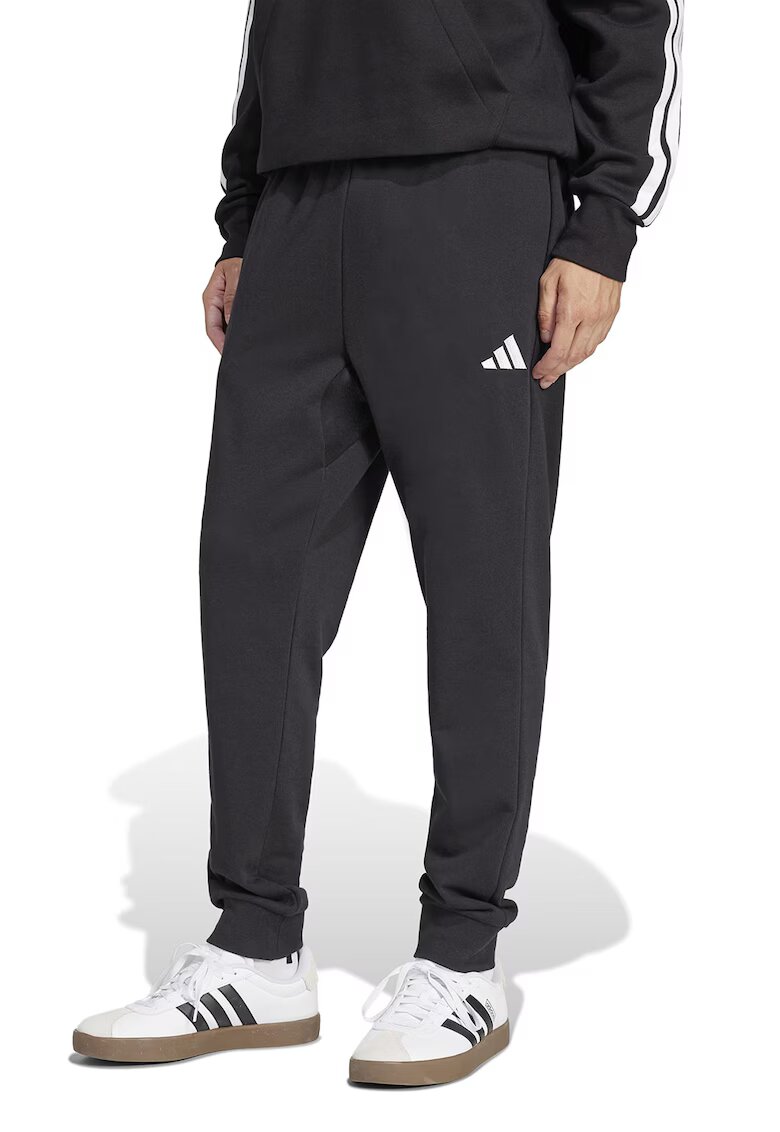 ADIDAS SPORTSWEAR Pantaloni de trening conici cu buzunare laterale - Alb/Negru