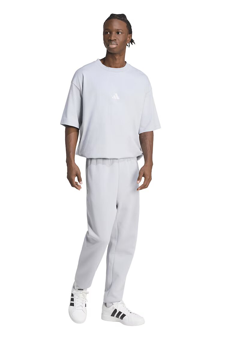 ADIDAS SPORTSWEAR Pantaloni de trening conici cu buzunare laterale - Gri deschis