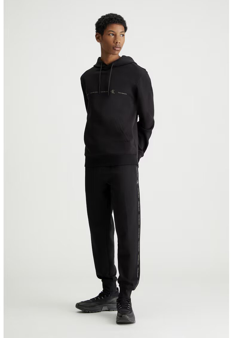 Calvin Klein Jeans Pantaloni de trening cu croiala conica si benzi laterale cu logo - Negru