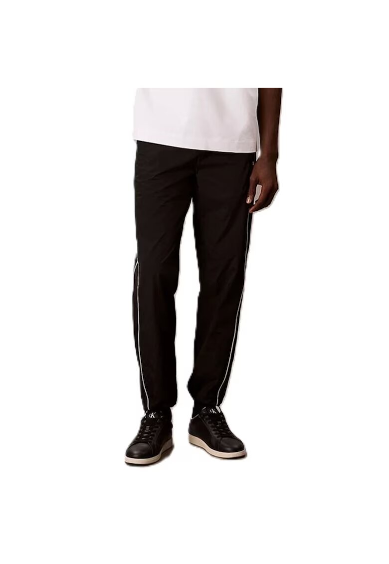 Calvin Klein Pantaloni RELAXED CRINKLE NYLONTRACK PANT-LV04RC522G-UB1