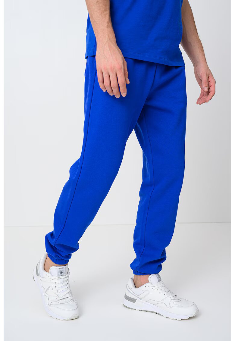 GAP Pantaloni de trening din amestec de bumbac cu logo - Albastru royal