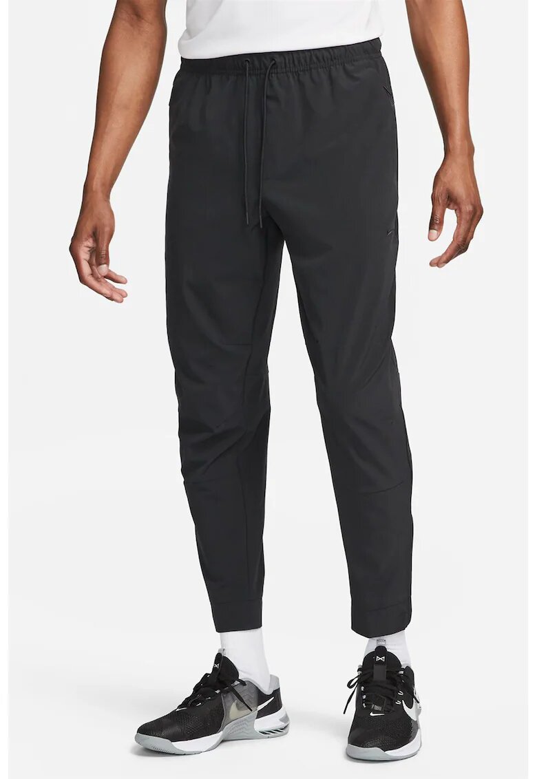 Nike Pantaloni conici cu tehnologie Dri-FIT si slituri cu fermoar Unlimited - Negru