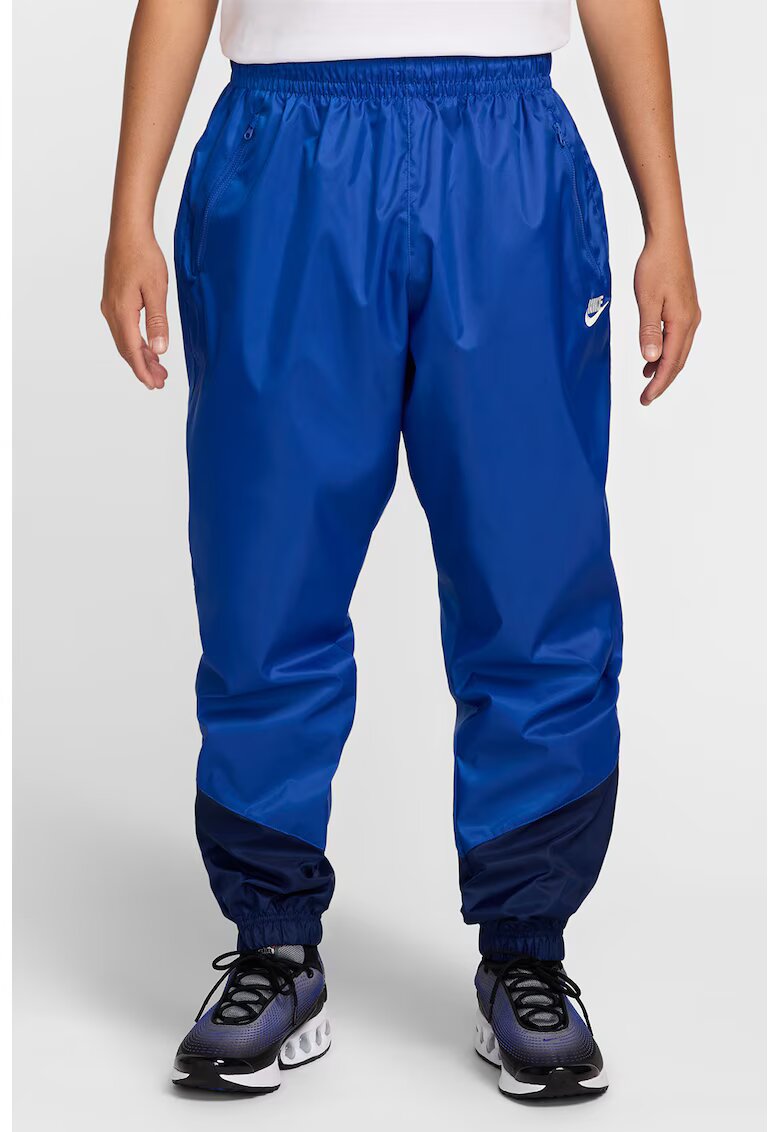 Nike Pantaloni cu slituri cu fermoar la glezna Windrunner - Albastru royal/Bleumarin