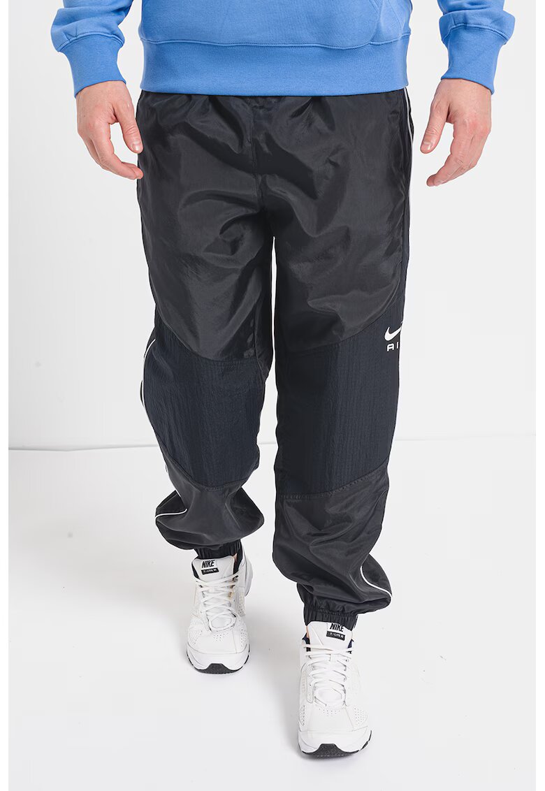 Nike Pantaloni de trening relaxed fit cu buzunare laterale - Negru