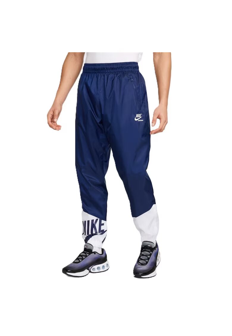 Nike Pantaloni M NK WR WVN LND GFX PANT-HJ2034-492