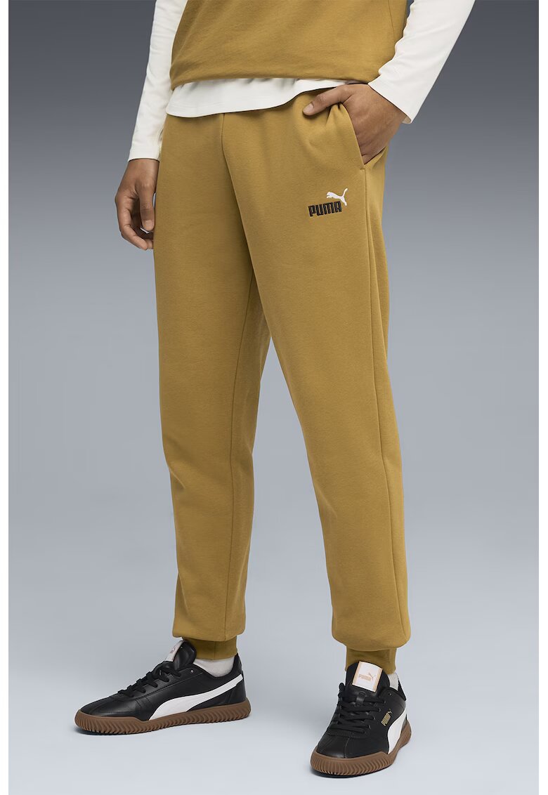 Puma Pantaloni de trening cu logo ESS 2 - Galben inchis