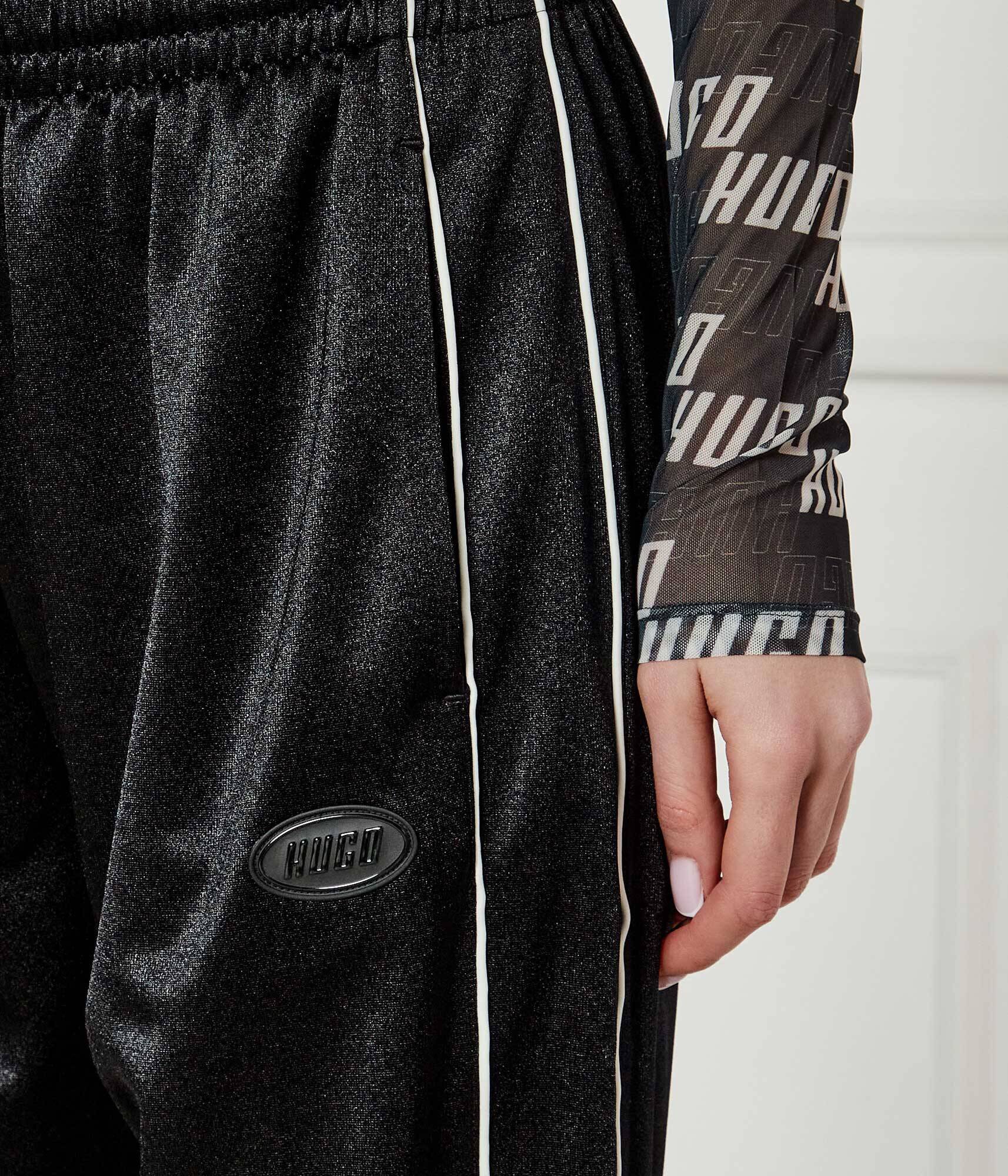 Hugo Pantaloni de trening Neannet | flare fit