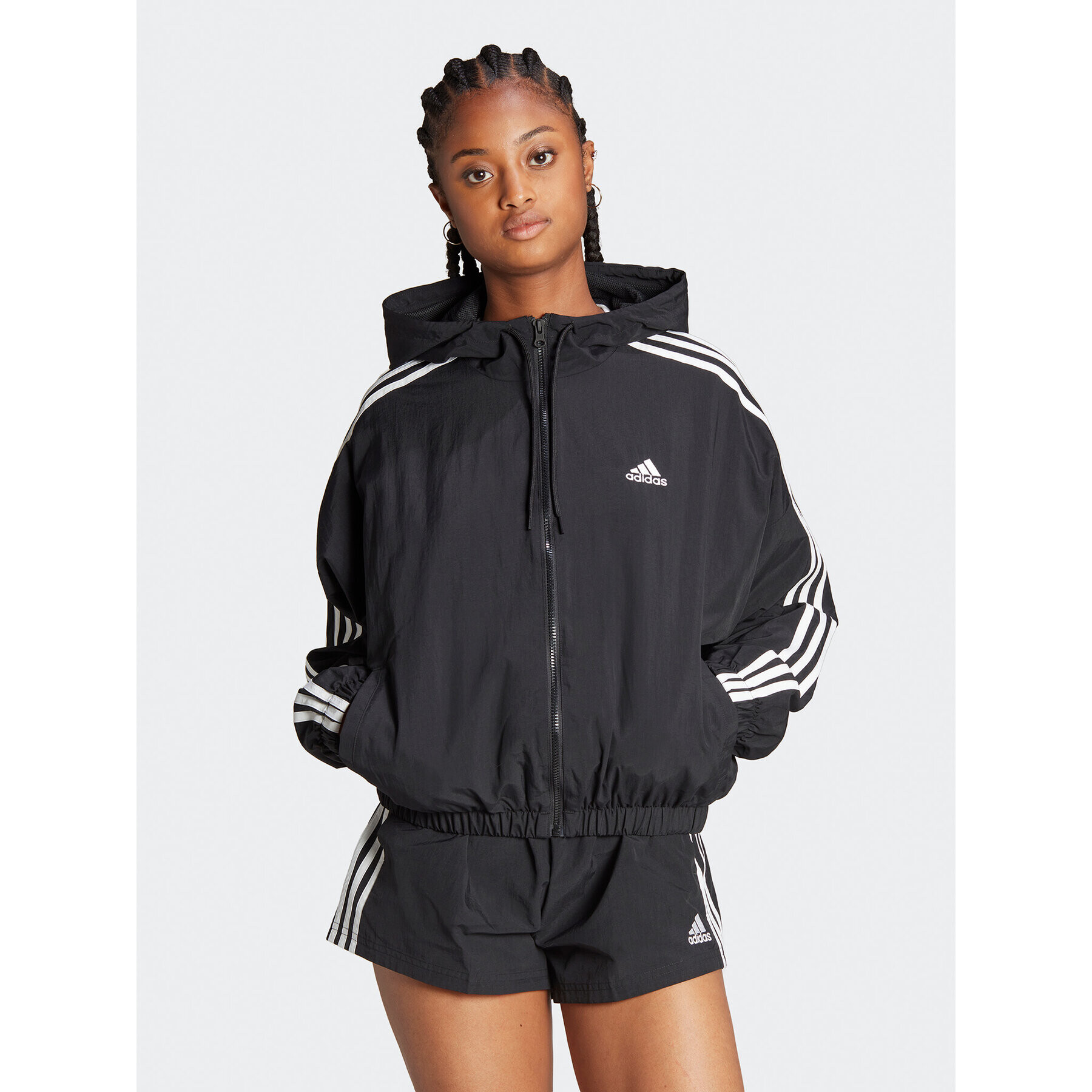 adidas Geacă de vânt Essentials 3-Stripes Woven Windbreaker HT3399 Negru Loose Fit - Pled.ro