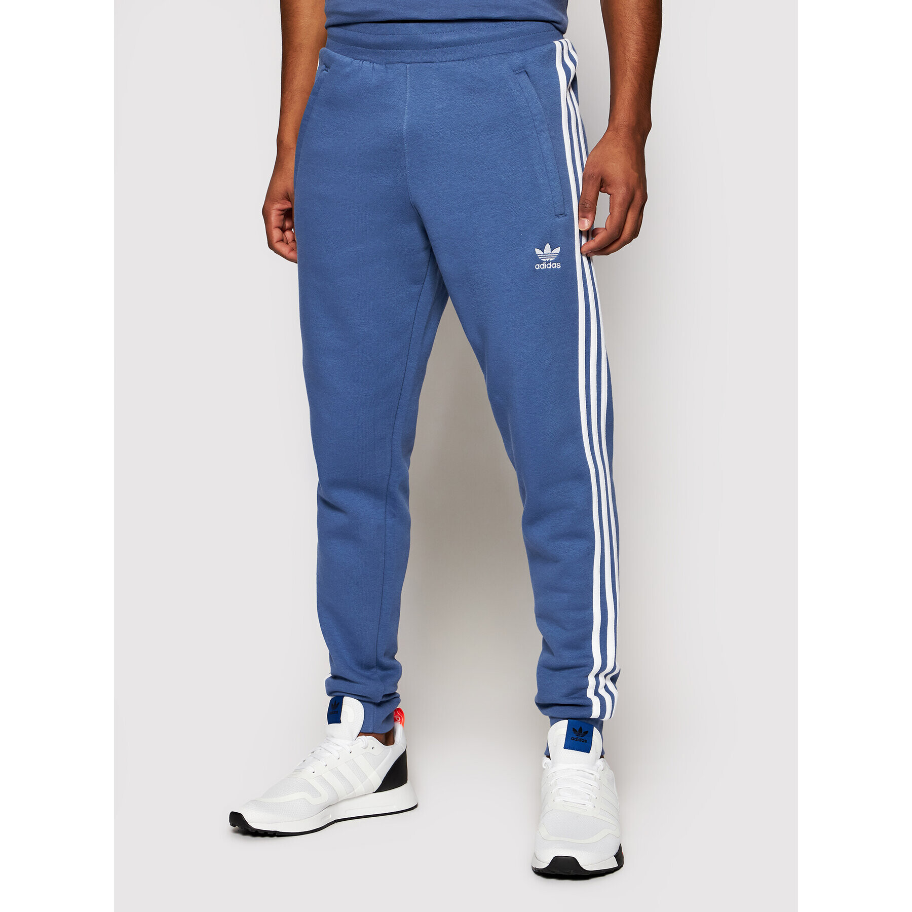 adidas Pantaloni trening adicolor Classics 3-Stripes GN3528 Albastru Slim Fit - Pled.ro