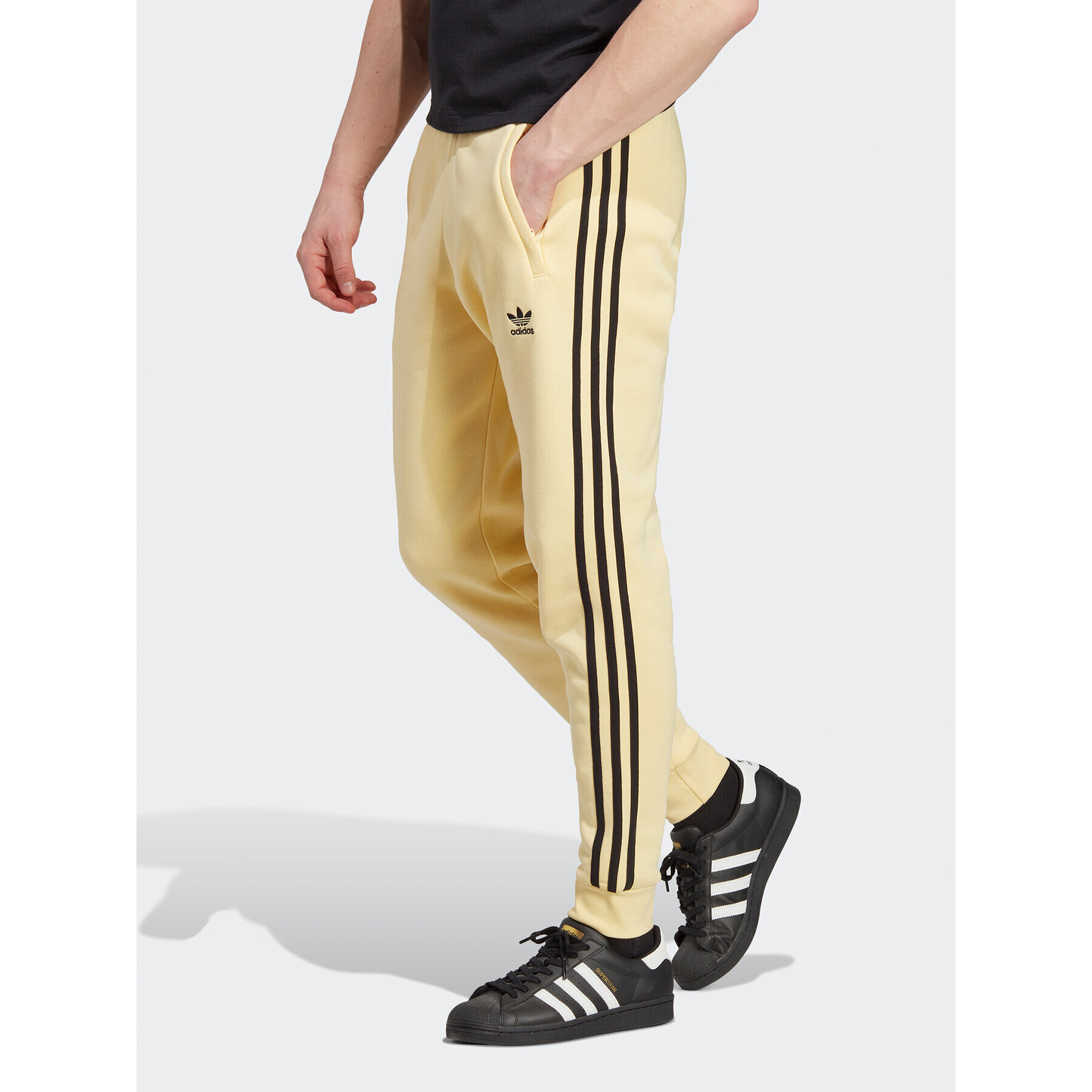 adidas Pantaloni trening Adicolor Classics 3-Stripes Joggers IA4793 Galben Fitted Fit - Pled.ro