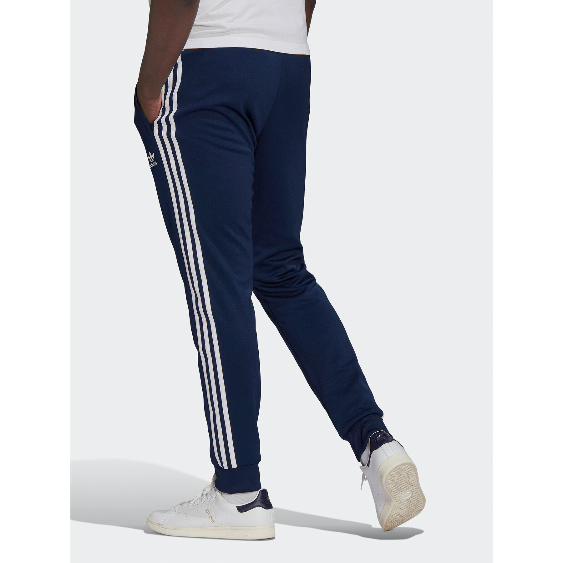 adidas Pantaloni trening ADICOLOR CLASSICS PRIMEBLUE SST Tracksuit Bottom HK7353 Albastru Slim Fit - Pled.ro