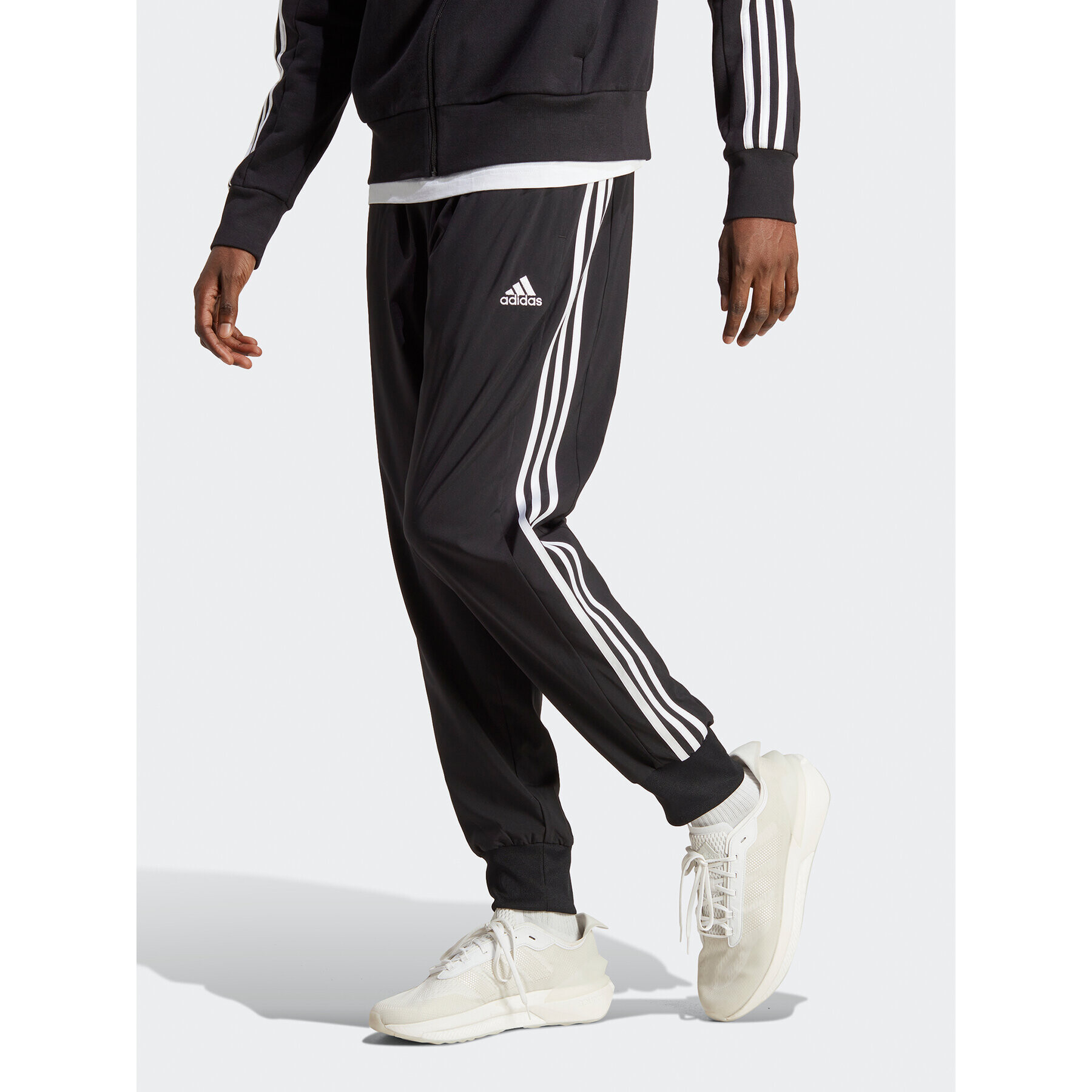 adidas Pantaloni trening AEROREADY Essentials Tapered Cuff Woven 3-Stripes Joggers IC0041 Negru Regular Fit - Pled.ro