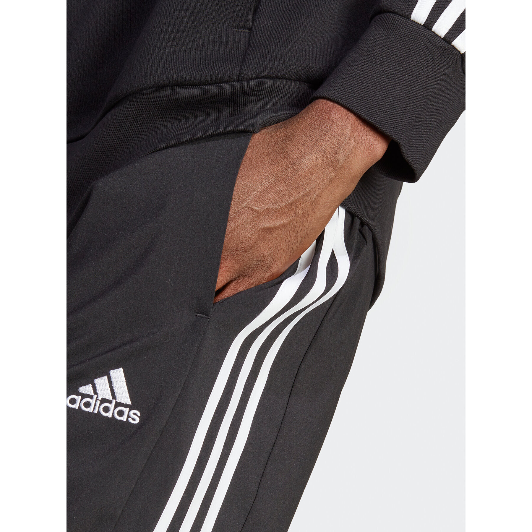 adidas Pantaloni trening AEROREADY Essentials Tapered Cuff Woven 3-Stripes Joggers IC0041 Negru Regular Fit - Pled.ro