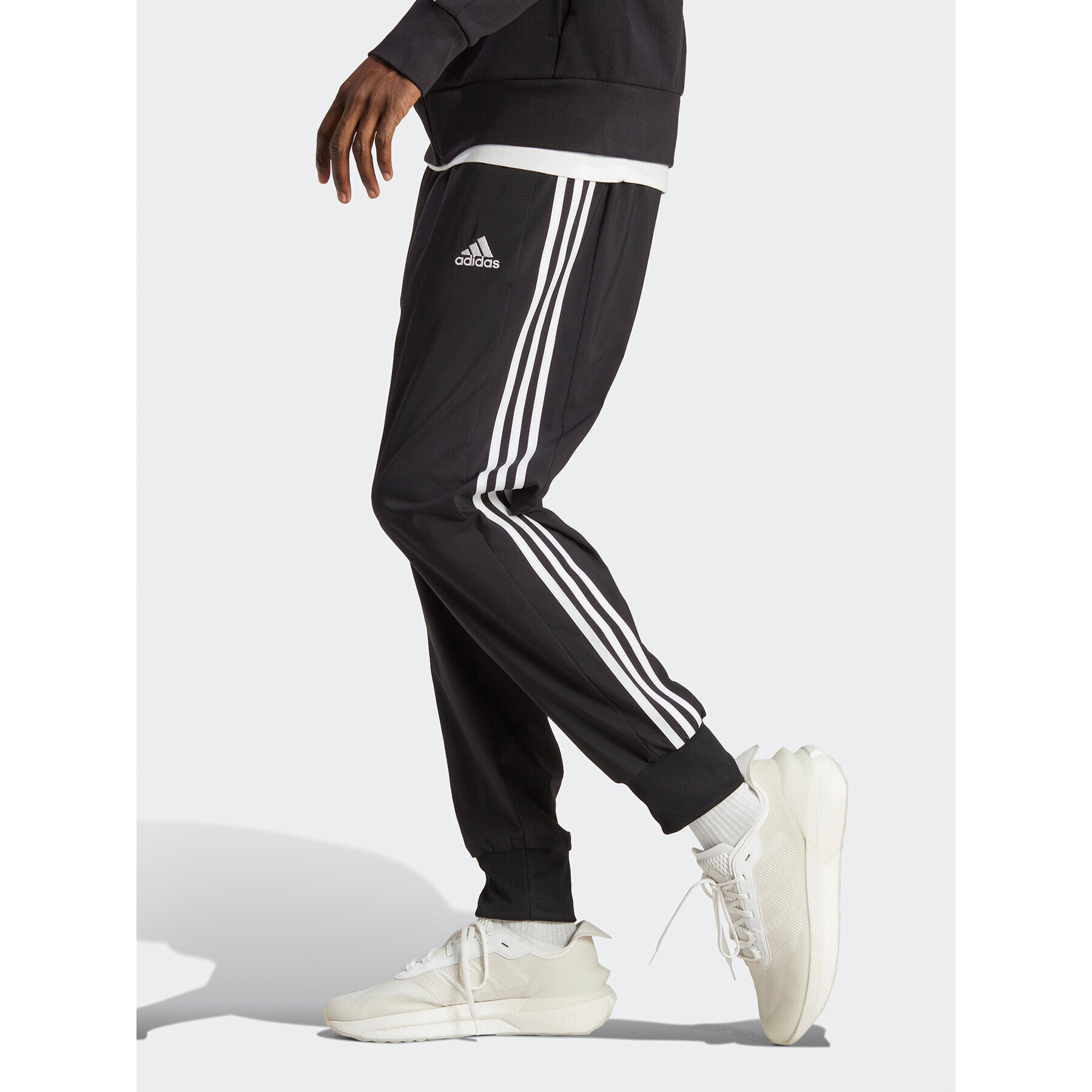 adidas Pantaloni trening AEROREADY Essentials Tapered Cuff Woven 3-Stripes Joggers IC0041 Negru Regular Fit - Pled.ro