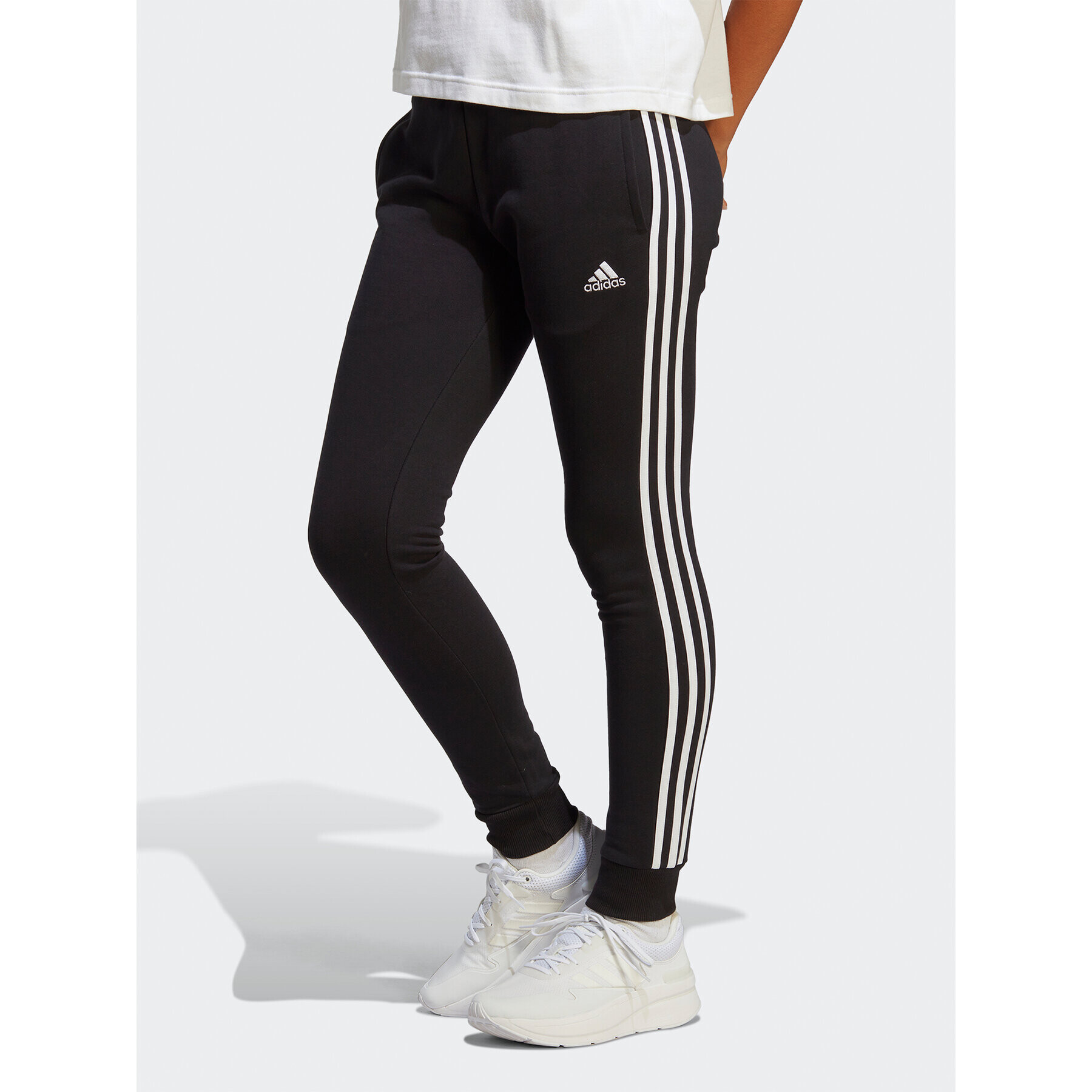 adidas Pantaloni trening Essentials 3-Stripes French Terry Cuffed Joggers IC8770 Negru Slim Fit - Pled.ro