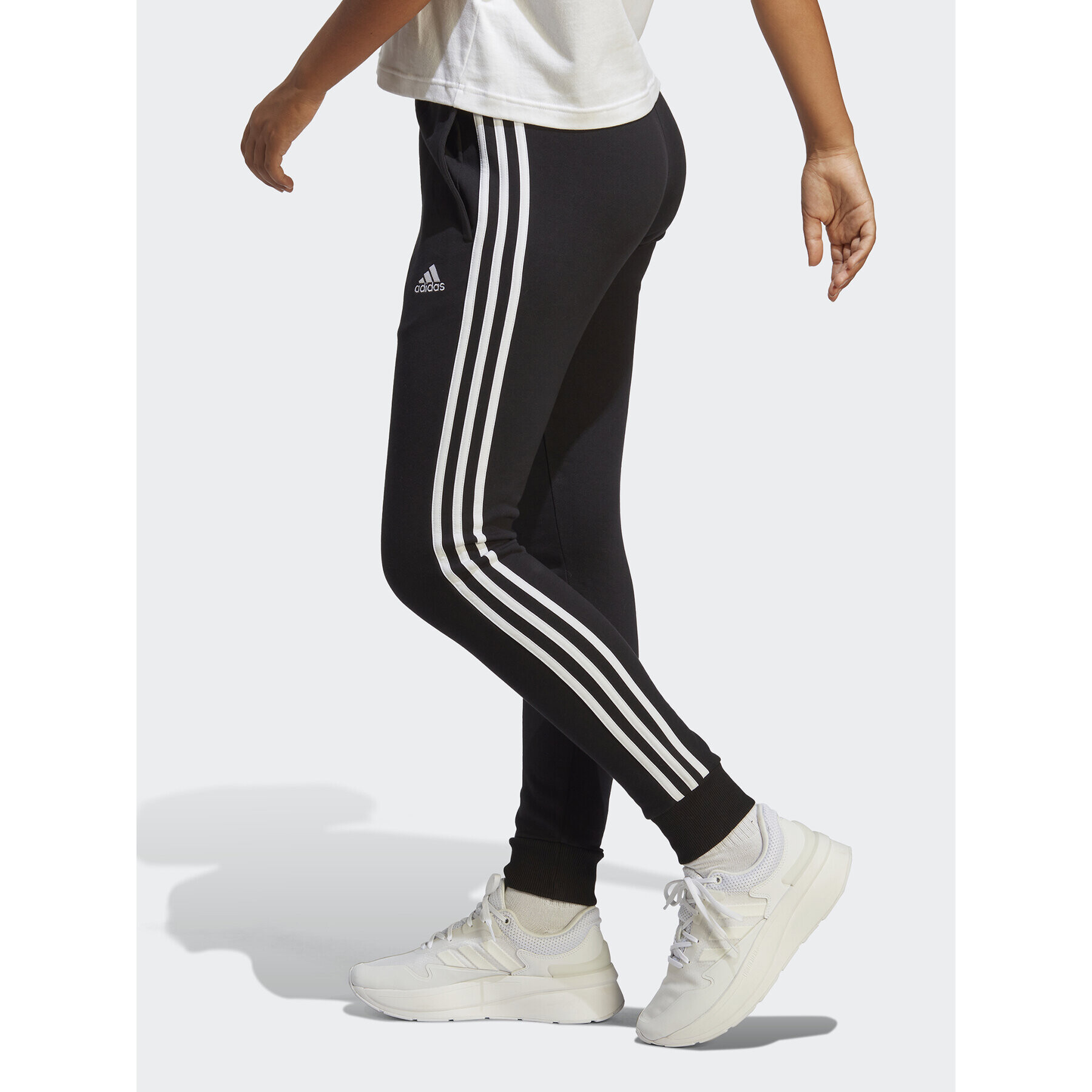 adidas Pantaloni trening Essentials 3-Stripes French Terry Cuffed Joggers IC8770 Negru Slim Fit - Pled.ro