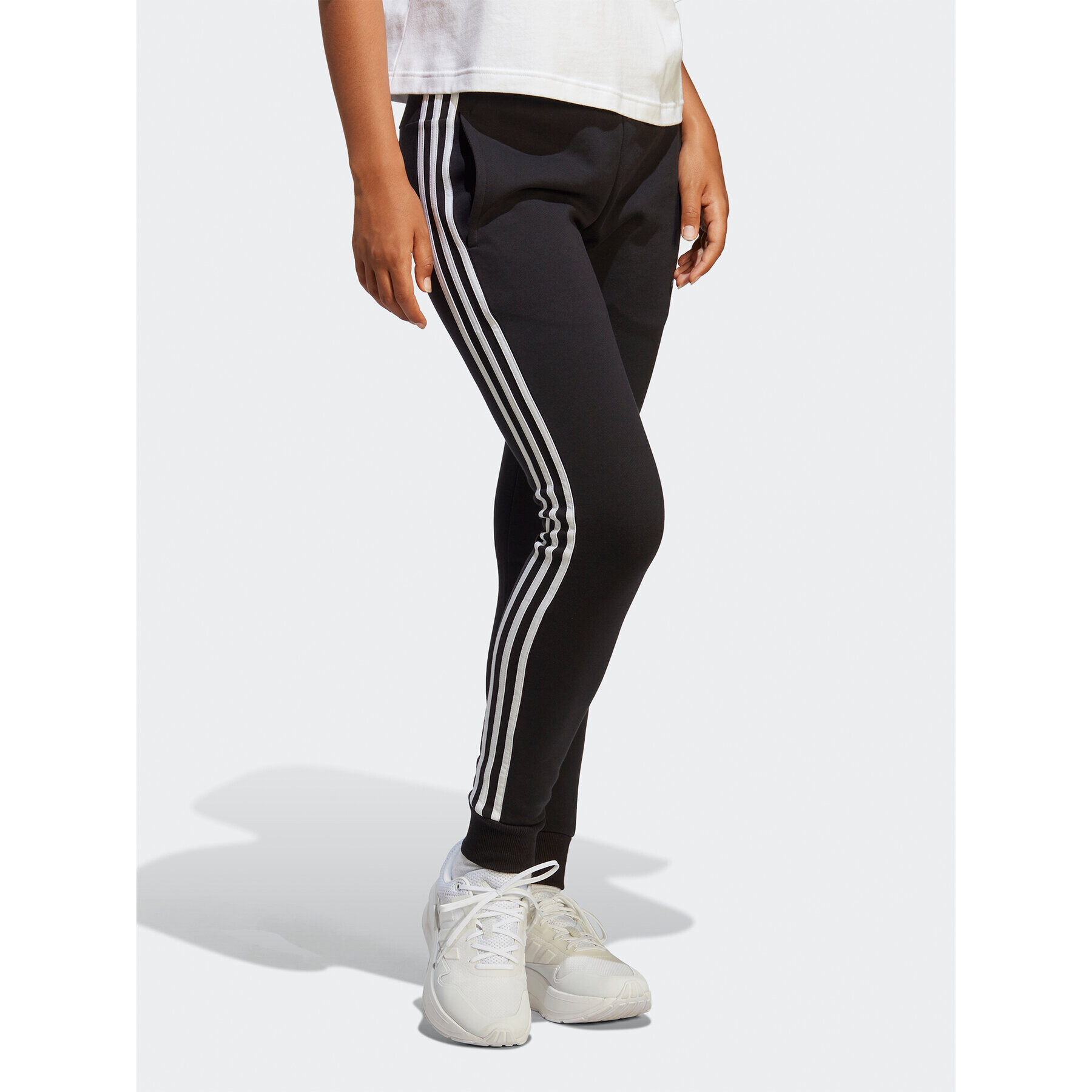 adidas Pantaloni trening Essentials 3-Stripes French Terry Cuffed Joggers IC8770 Negru Slim Fit - Pled.ro