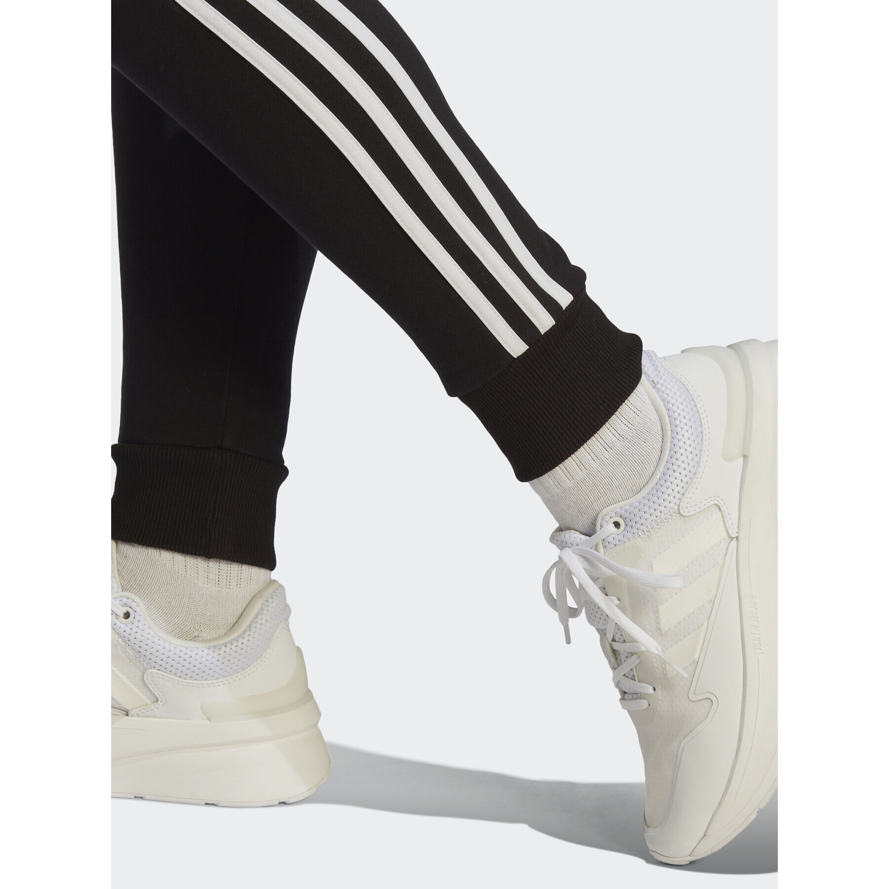 adidas Pantaloni trening Essentials 3-Stripes French Terry Cuffed Joggers IC8770 Negru Slim Fit - Pled.ro