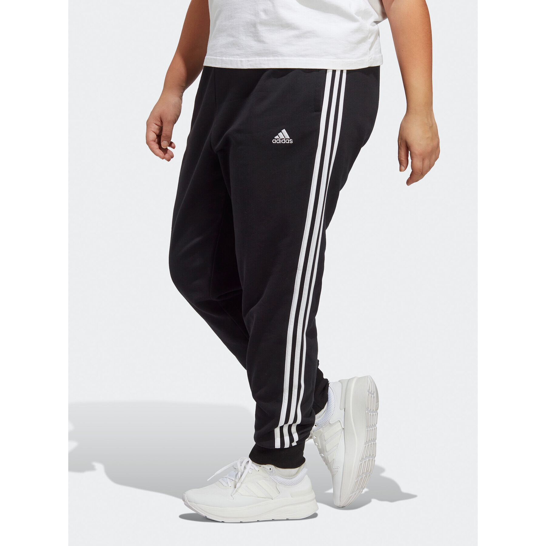 adidas Pantaloni trening Essentials 3-Stripes French Terry Cuffed Joggers (Plus Size) IB8745 Negru Slim Fit - Pled.ro