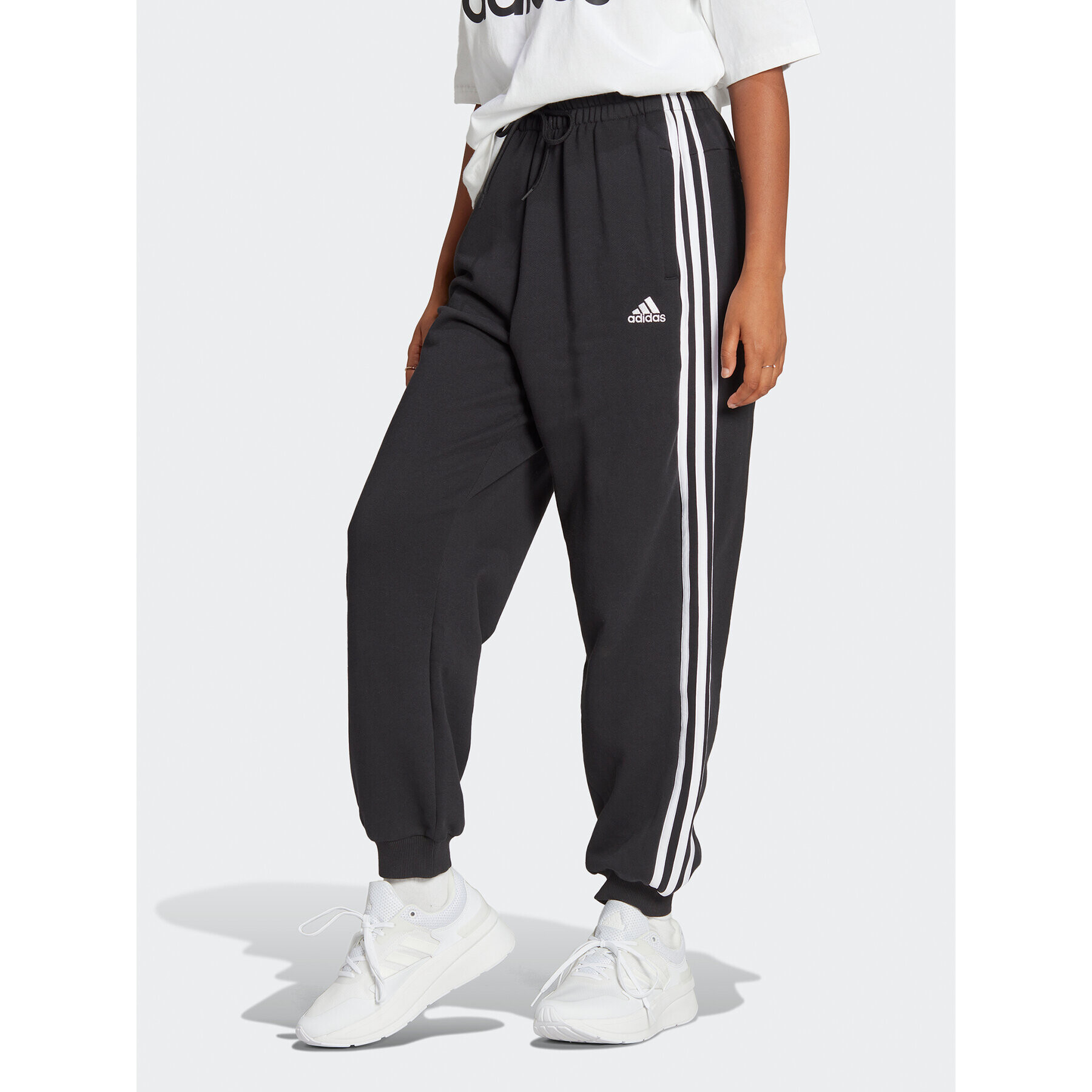 adidas Pantaloni trening Essentials 3-Stripes French Terry Loose-Fit Joggers HA4375 Negru Loose Fit - Pled.ro