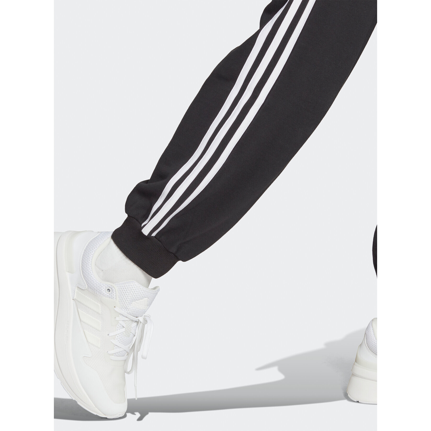 adidas Pantaloni trening Essentials 3-Stripes French Terry Loose-Fit Joggers HA4375 Negru Loose Fit - Pled.ro