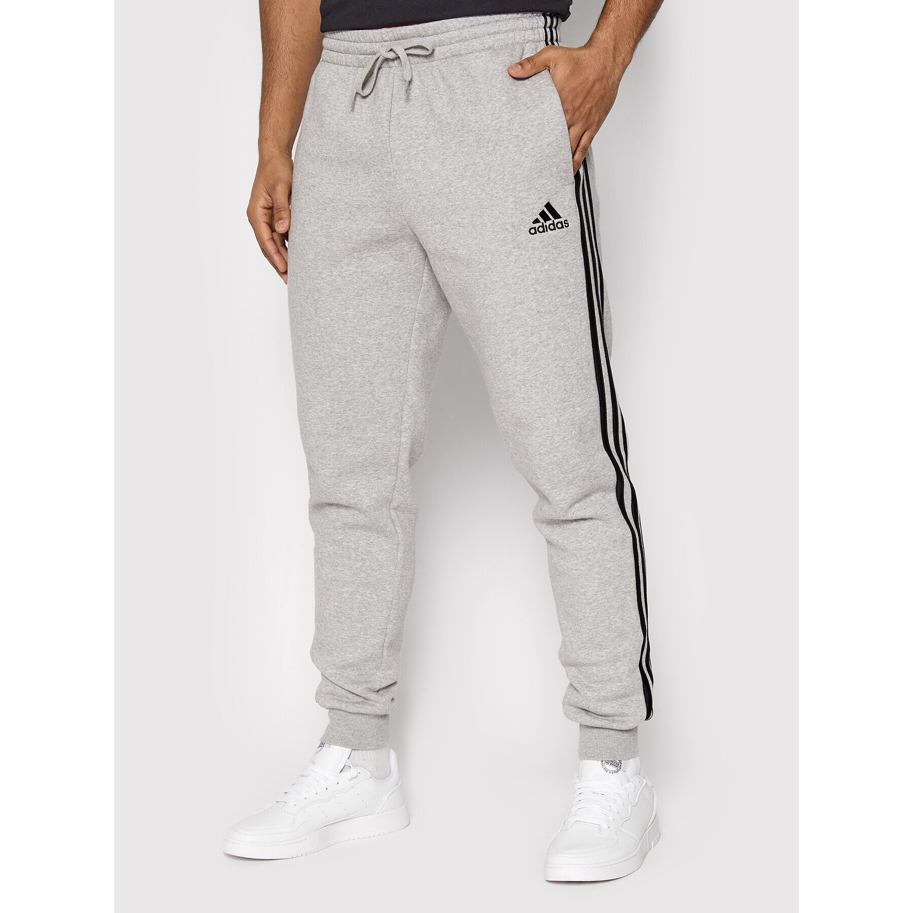 adidas Pantaloni trening Essentials 3-Stripes GM1091 Gri Slim Fit - Pled.ro