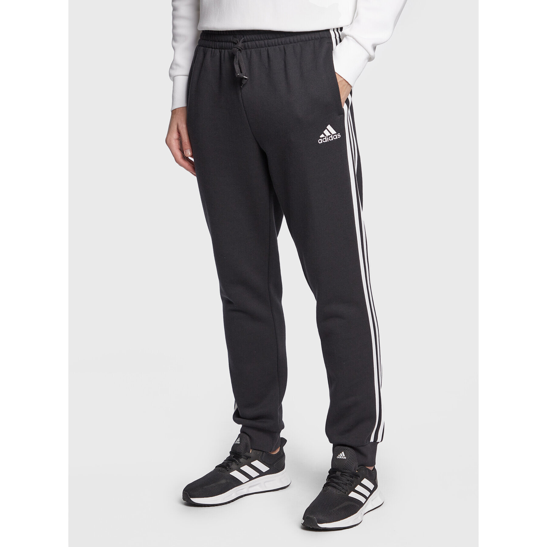 adidas Pantaloni trening Essentials Fleece GK8821 Negru Regular Fit - Pled.ro