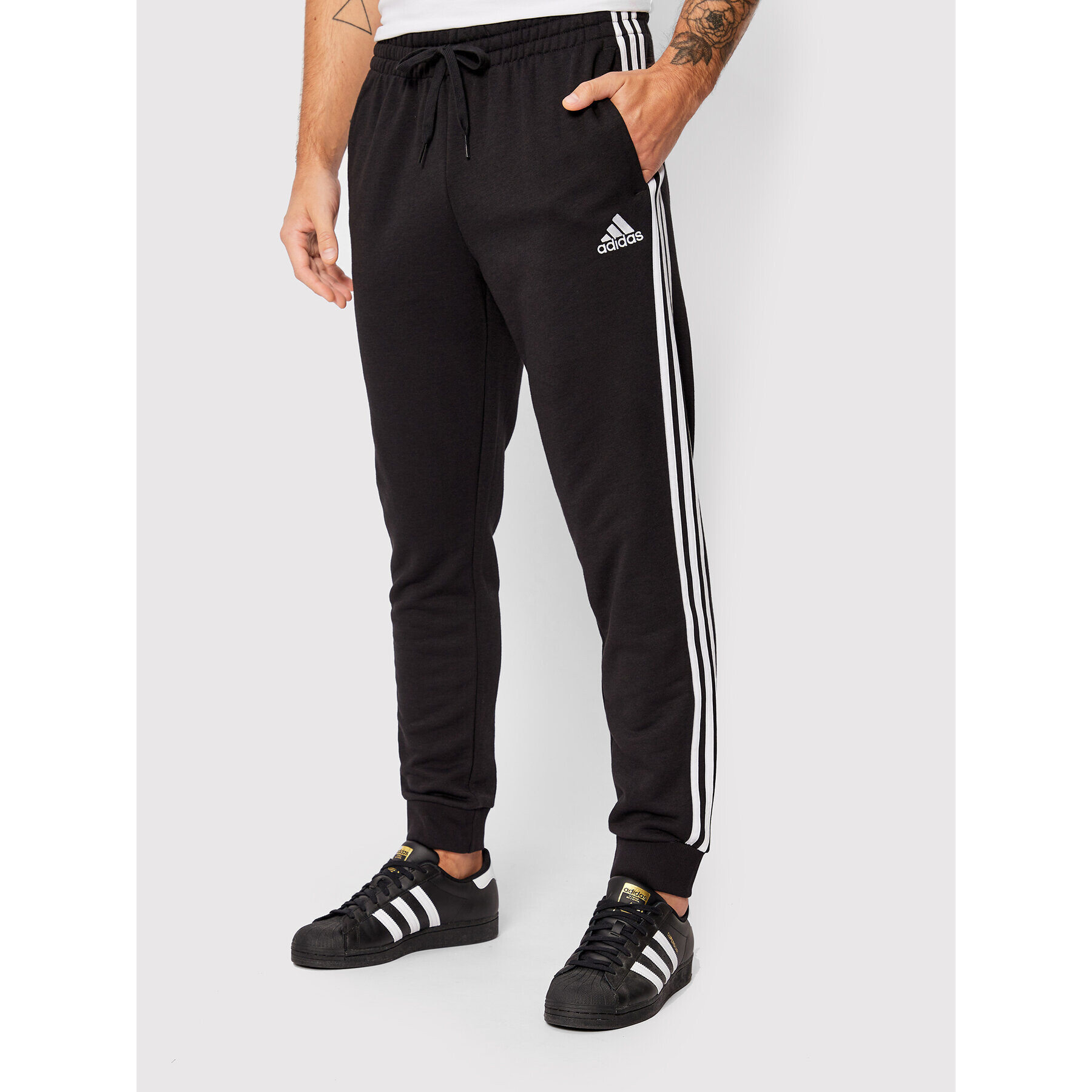 adidas Pantaloni trening Essentials French Terry GK8831 Negru Regular Fit - Pled.ro