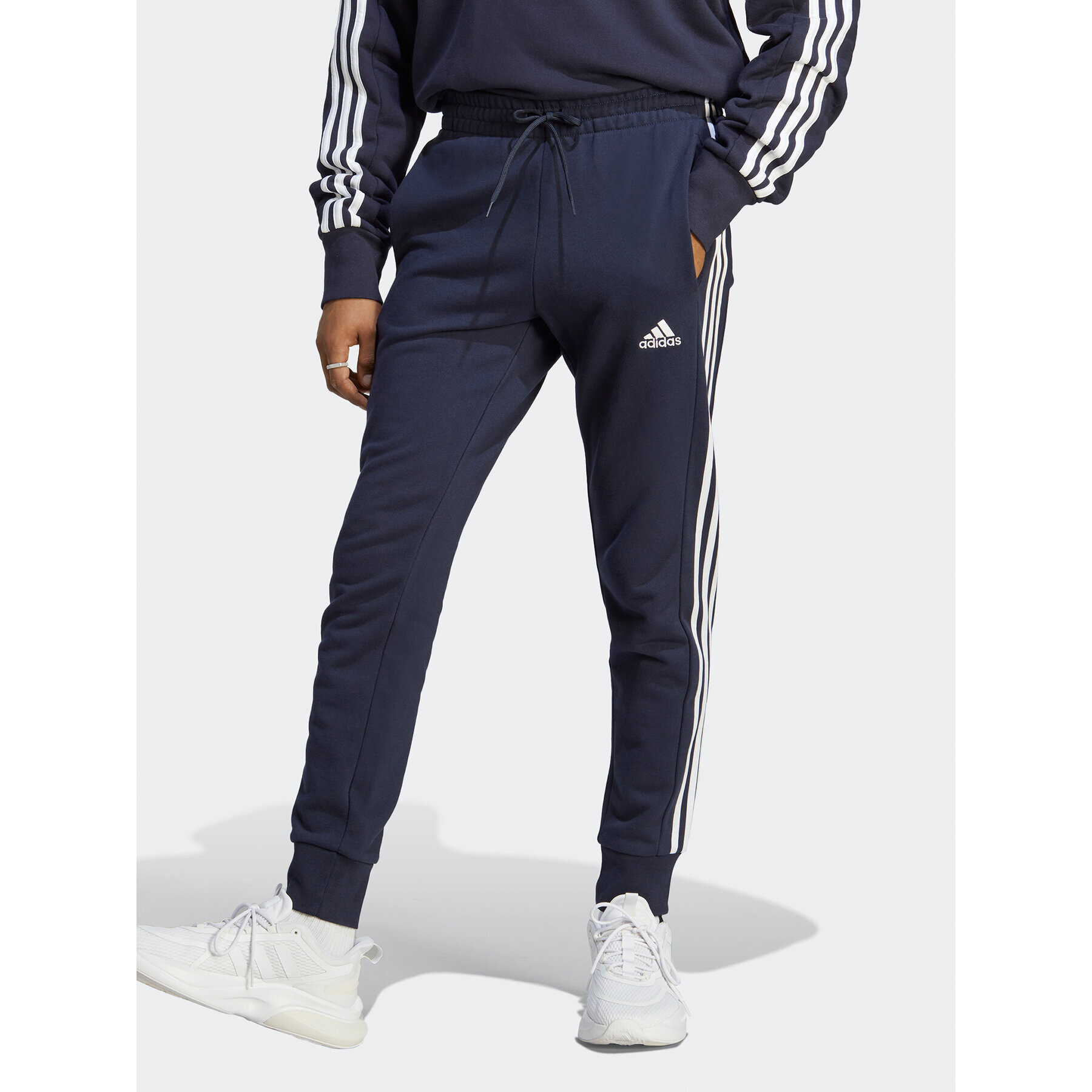 adidas Pantaloni trening Essentials French Terry Tapered Cuff 3-Stripes Joggers IC9406 Albastru Regular Fit - Pled.ro