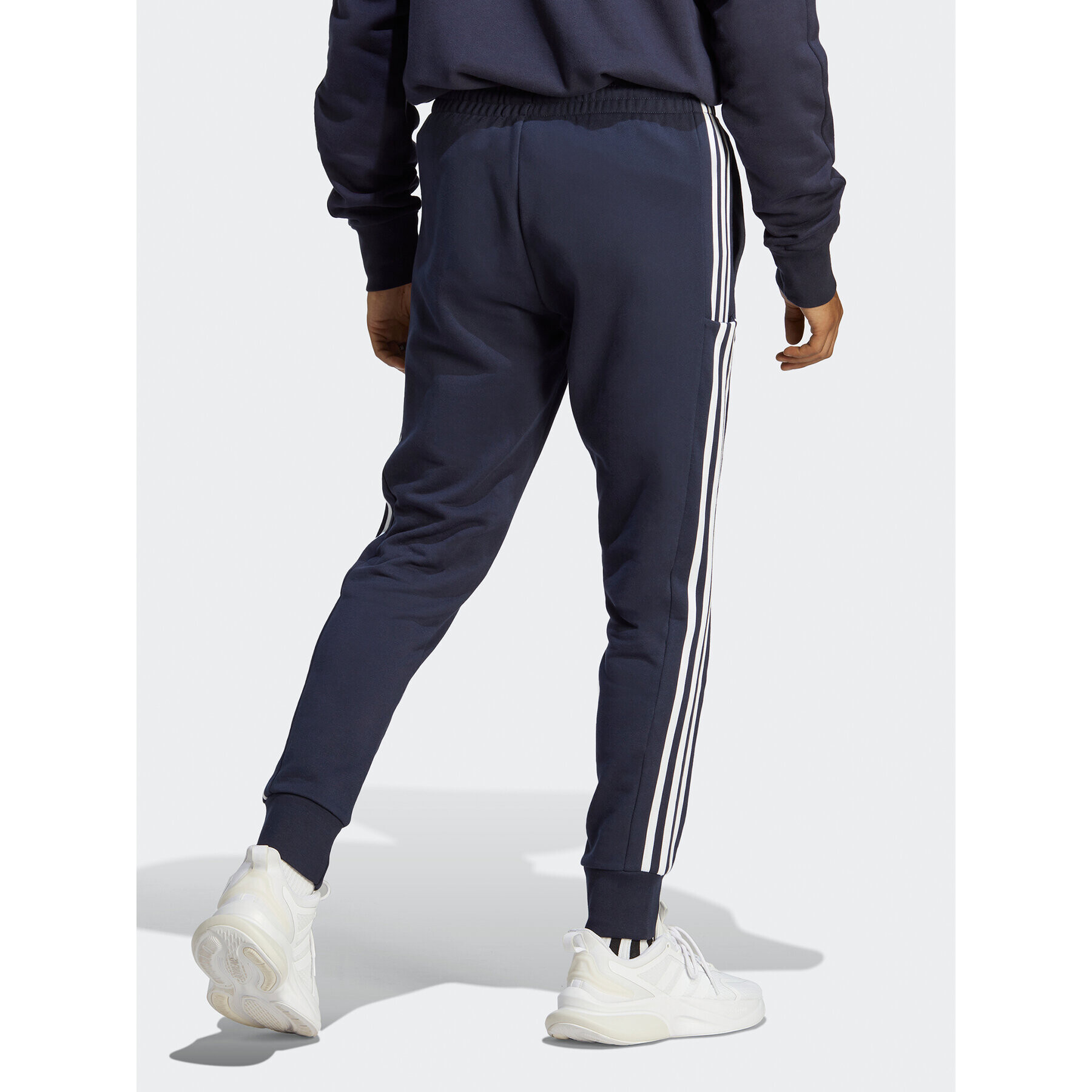 adidas Pantaloni trening Essentials French Terry Tapered Cuff 3-Stripes Joggers IC9406 Albastru Regular Fit - Pled.ro