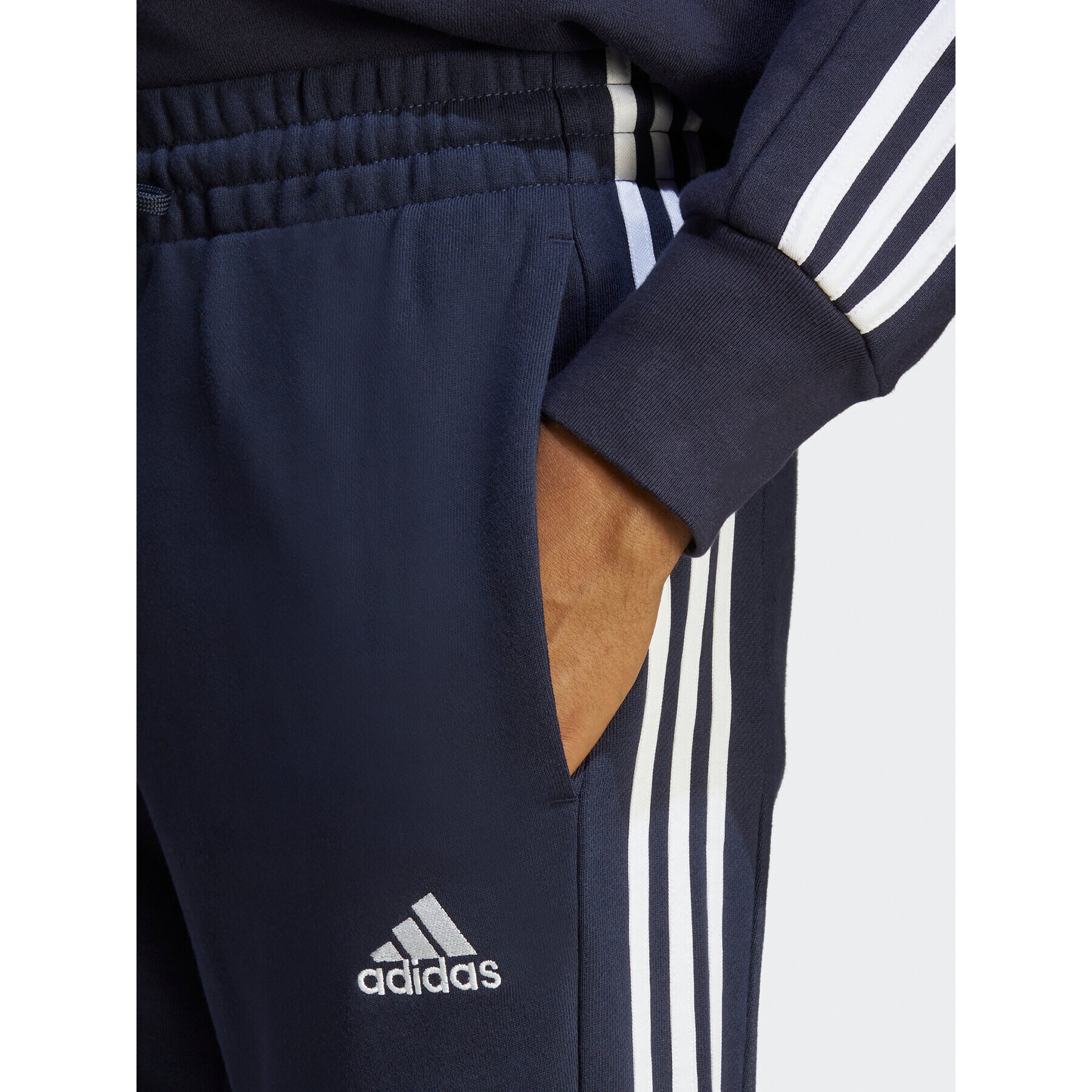 adidas Pantaloni trening Essentials French Terry Tapered Cuff 3-Stripes Joggers IC9406 Albastru Regular Fit - Pled.ro