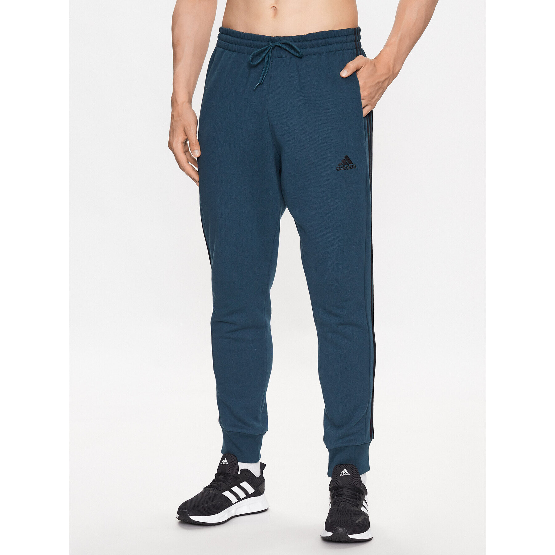 adidas Pantaloni trening Essentials French Terry Tapered Cuff 3-Stripes Joggers IJ8698 Turcoaz Regular Fit - Pled.ro