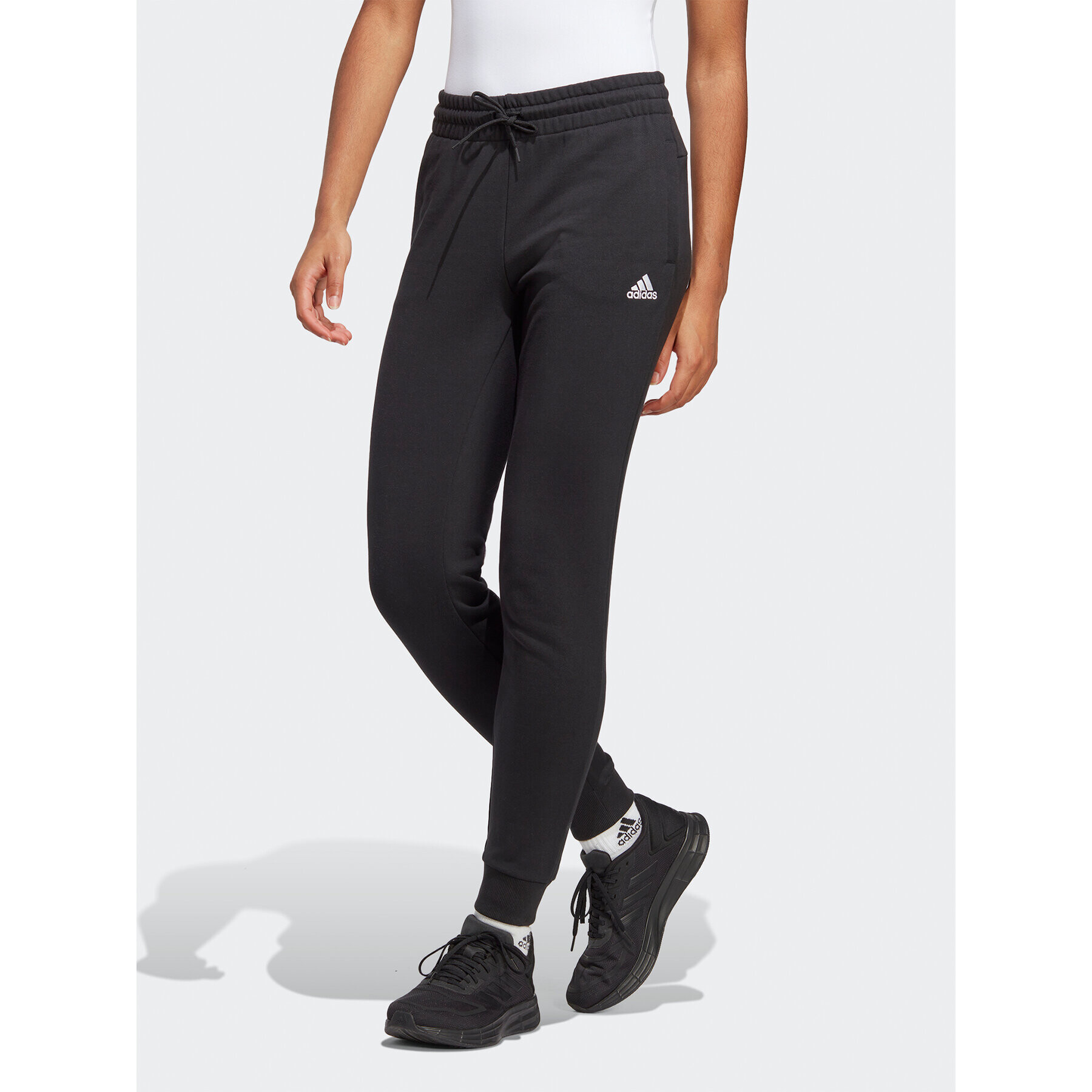 adidas Pantaloni trening Essentials Linear French Terry Cuffed Joggers IC6868 Negru Slim Fit - Pled.ro