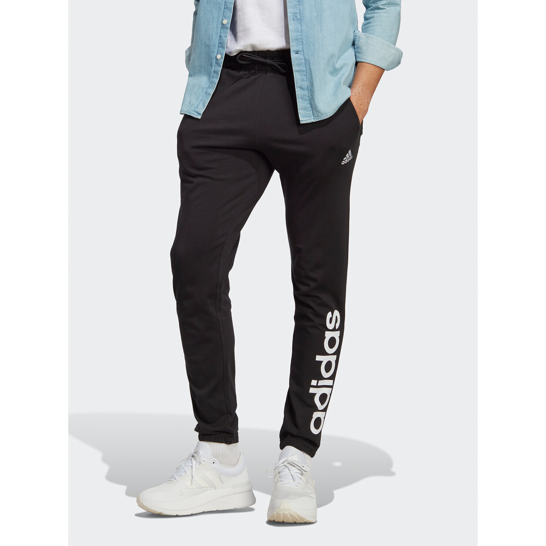 adidas Pantaloni trening Essentials Single Jersey Tapered Elasticized Cuff Logo Joggers IC0055 Negru Regular Fit - Pled.ro