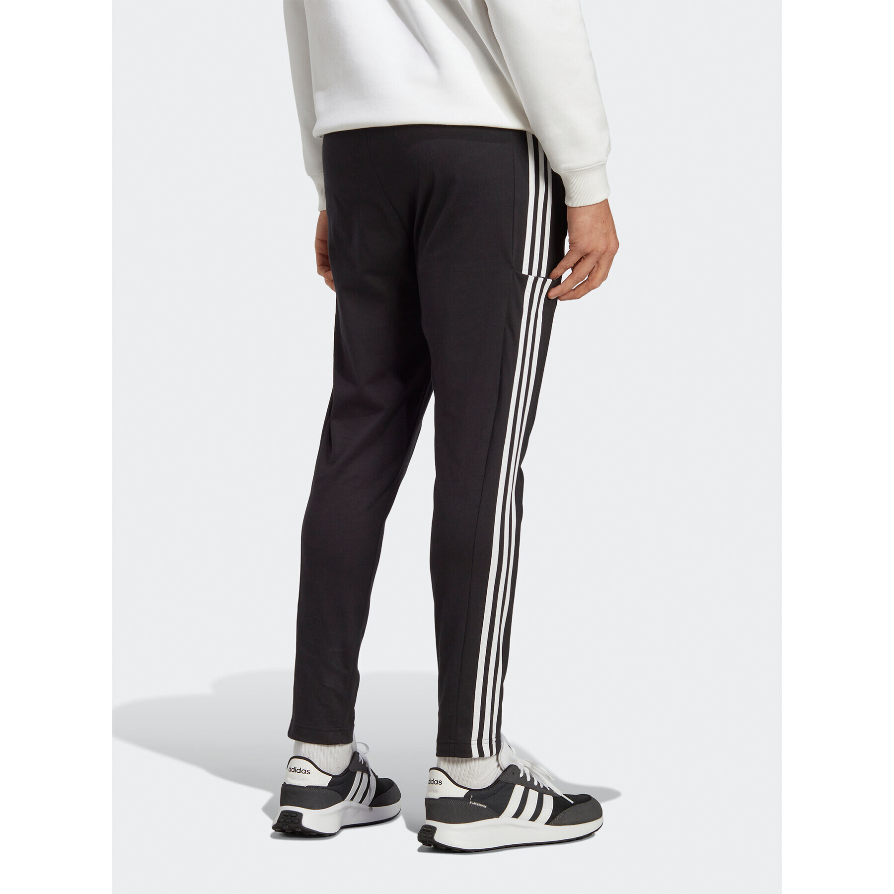 adidas Pantaloni trening Essentials Single Jersey Tapered Open Hem 3-Stripes Joggers IC0044 Negru Regular Fit - Pled.ro