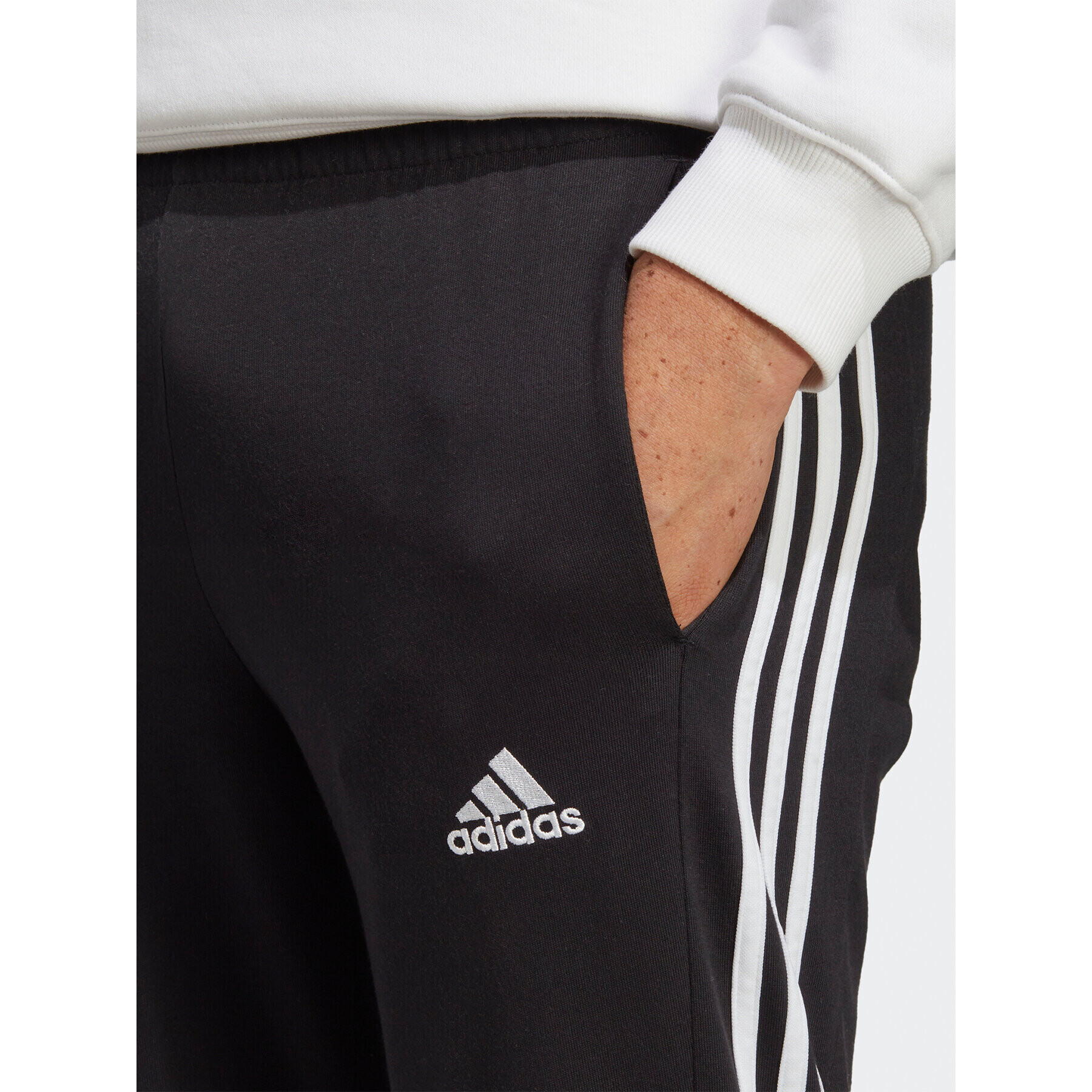 adidas Pantaloni trening Essentials Single Jersey Tapered Open Hem 3-Stripes Joggers IC0044 Negru Regular Fit - Pled.ro