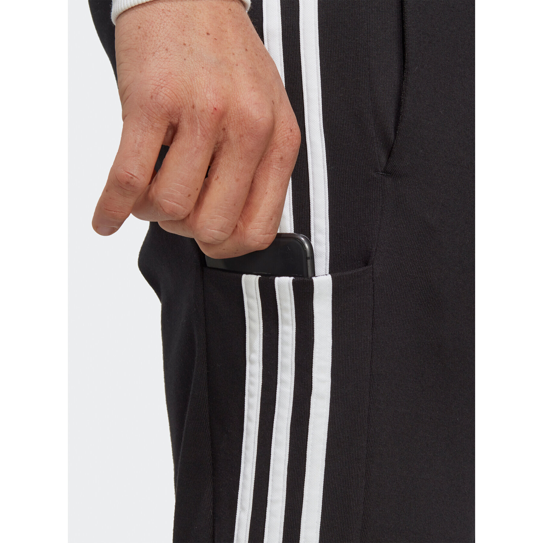 adidas Pantaloni trening Essentials Single Jersey Tapered Open Hem 3-Stripes Joggers IC0044 Negru Regular Fit - Pled.ro