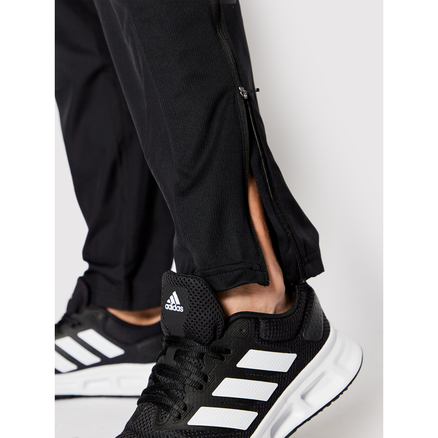 adidas Pantaloni trening Own The Run Astro Wind H13238 Negru Regular Fit - Pled.ro