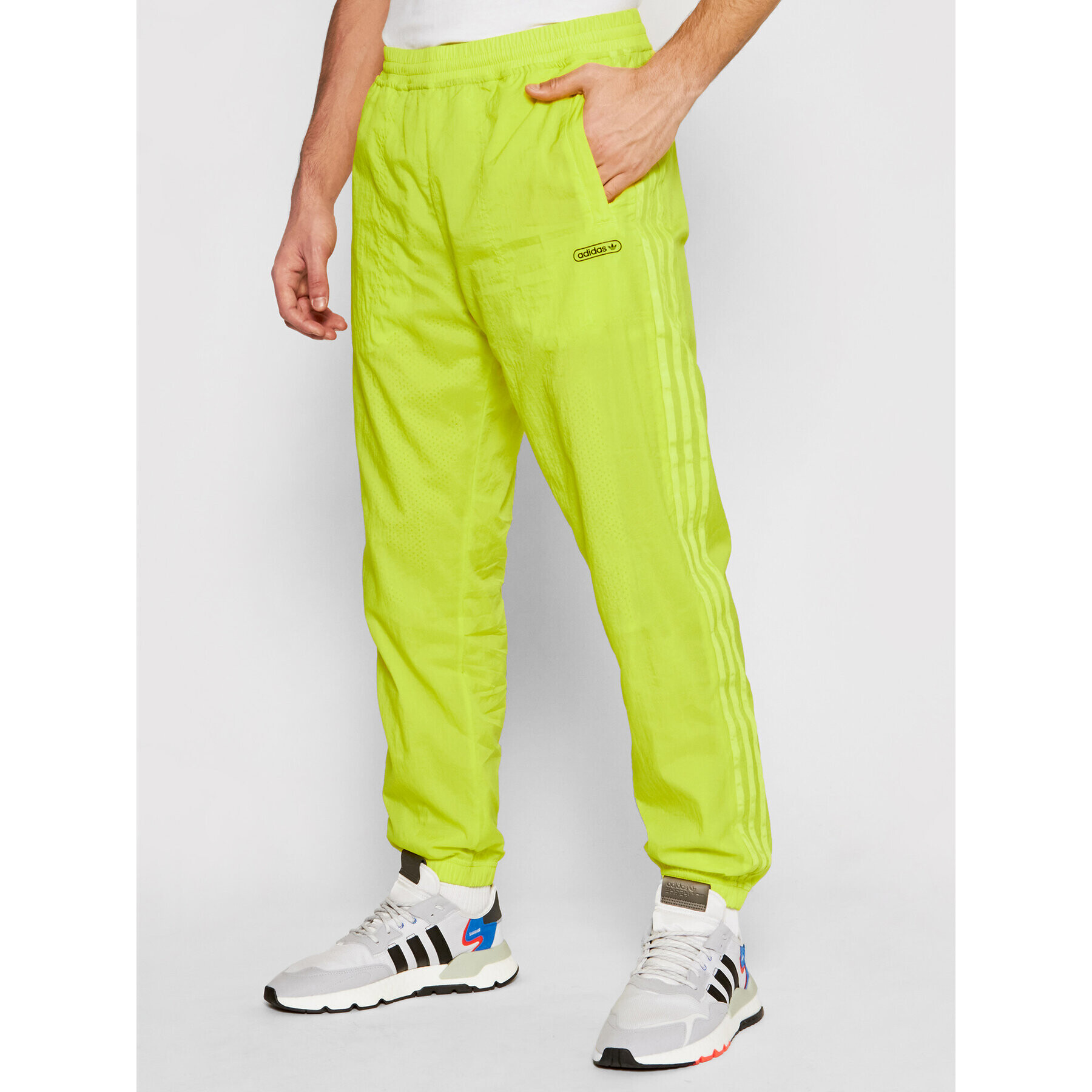 adidas Pantaloni trening Reverse Track GN3821 Galben Regular Fit - Pled.ro