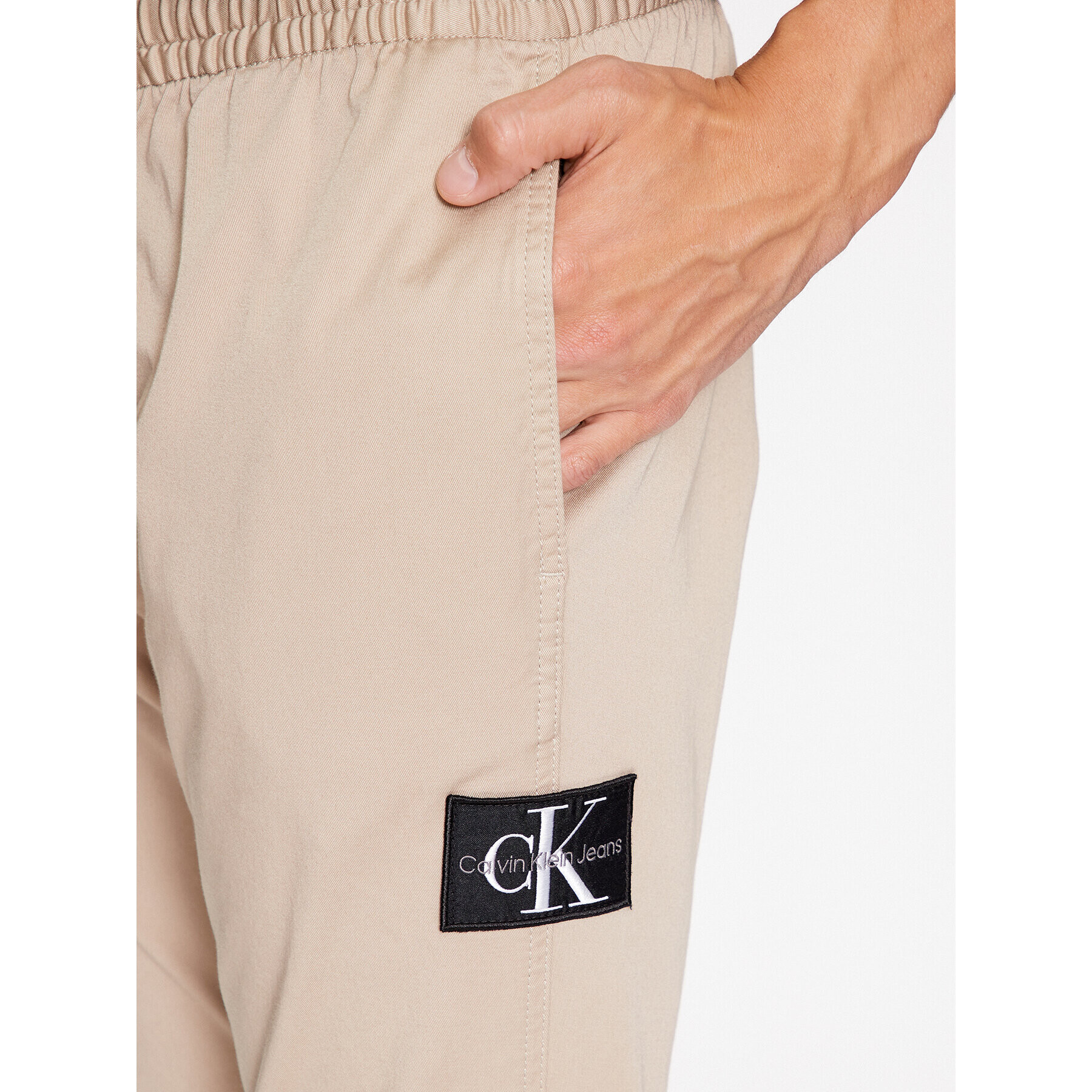 Calvin Klein Jeans Pantaloni din material Monologo J30J324045 Bej Slim Fit - Pled.ro