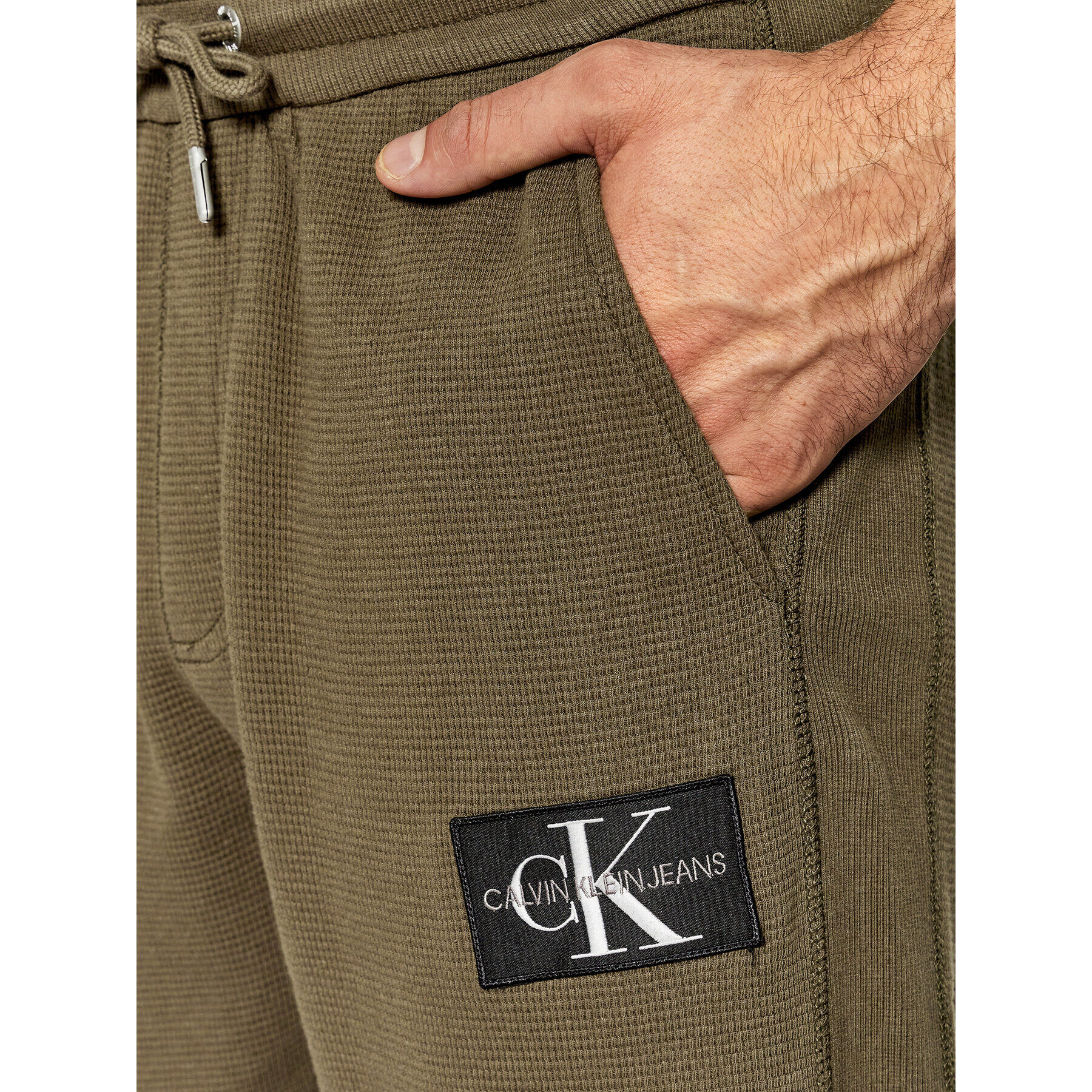 Calvin Klein Jeans Pantaloni trening J30J318589 Verde Regular Fit - Pled.ro