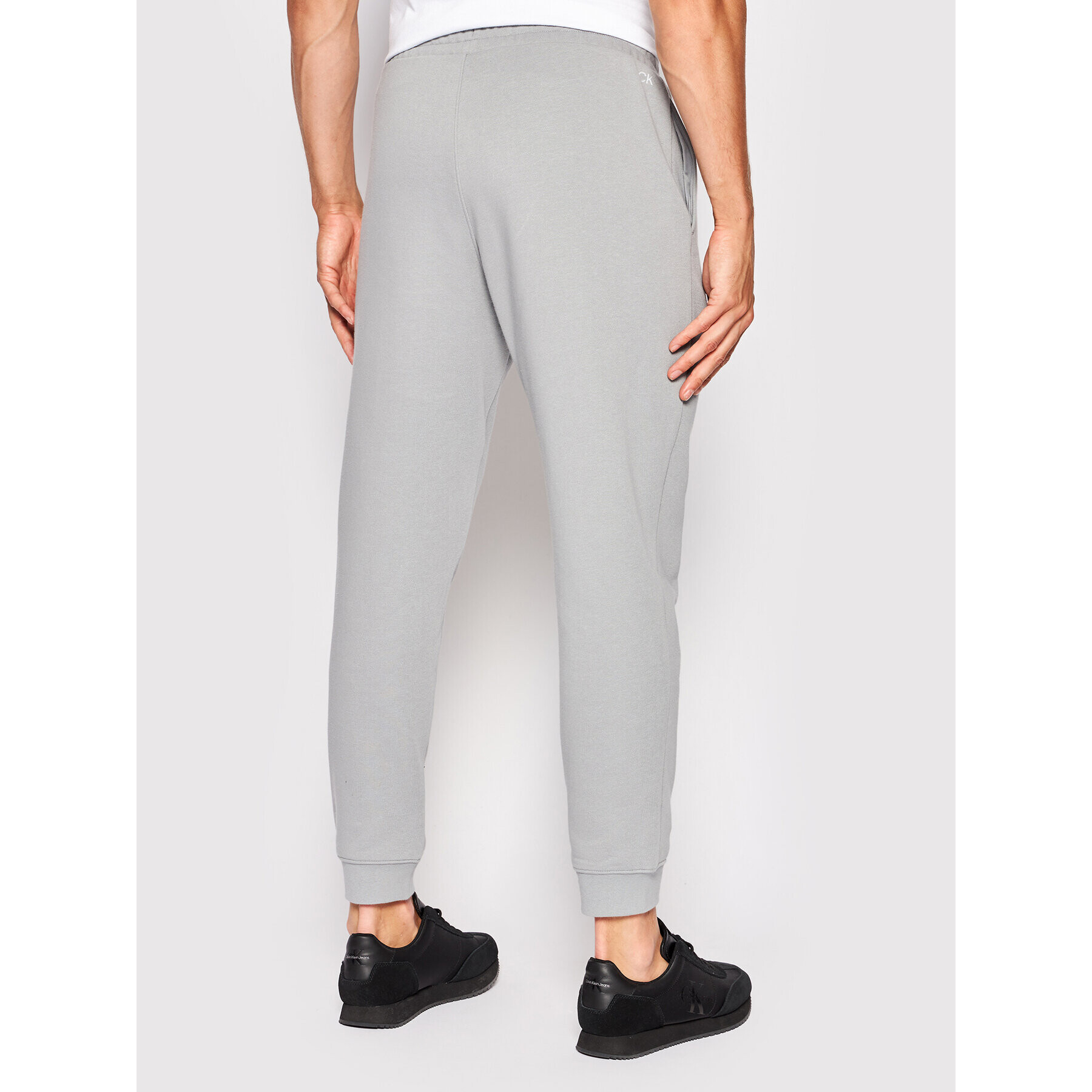 Calvin Klein Performance Pantaloni trening 00GMS2P606 Gri Regular Fit - Pled.ro