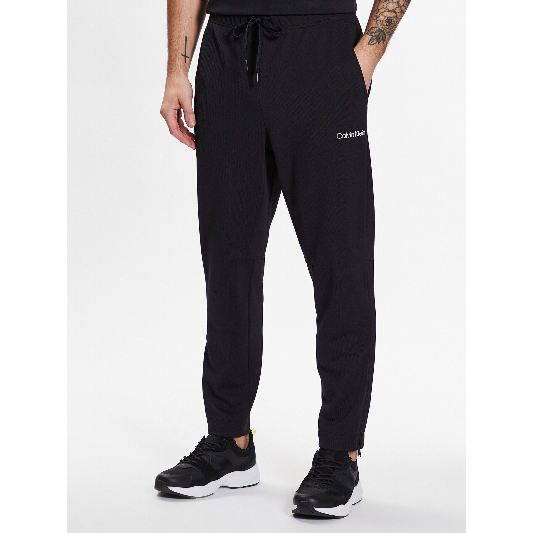 Calvin Klein Performance Pantaloni trening Knit Pant 00GMS3P602 Negru Regular Fit - Pled.ro